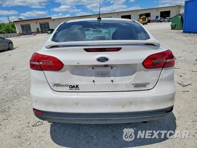 Zdjęcie 6 z 12 samochodu: 2015 FORD FOCUS TITANIUM VIN:1FADP3J24FL228725 - miniatura