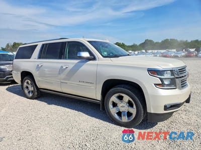 Czwarte zdjęcie samochodu z boku: 2015 CHEVROLET SUBURBAN K1500 LTZ VIN:1GNSKKKCXFR621005 - miniatura