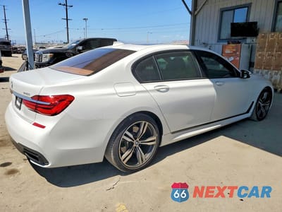 Trzecie zdjęcie samochodu z tyłu: 2016 BMW 740 I VIN:WBA7E2C51GG547344 - miniatura