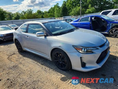 Czwarte zdjęcie samochodu z boku: 2014 SCION TC 10 SERIES VIN:JTKJF5C78E3072829 - miniatura
