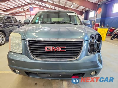 Piąte zdjęcie samochodu w środku: 2010 GMC YUKON SLT VIN:1GKUKCE05AR101610 - miniatura