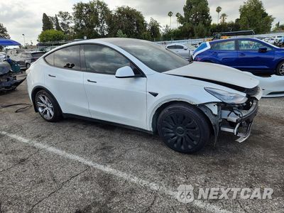 Czwarte zdjęcie samochodu z boku: 2021 TESLA MODEL Y VIN:5YJYGDEE8MF231343 - miniatura