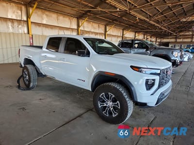 Czwarte zdjęcie samochodu z boku: 2025 GMC CANYON AT4 VIN:1GTP2DEK7S1113998 - miniatura