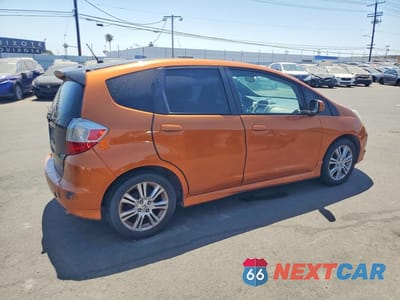 Trzecie zdjęcie samochodu z tyłu: 2011 HONDA FIT SPORT VIN:JHMGE8H67BS008755 - miniatura