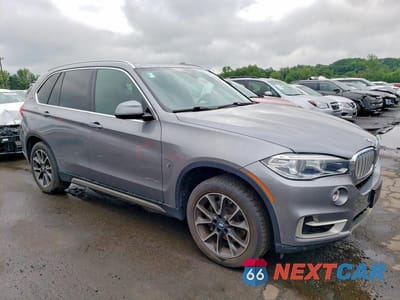 Czwarte zdjęcie samochodu z boku: 2018 BMW X5 XDR40E VIN:5UXKT0C57J0W03387 - miniatura