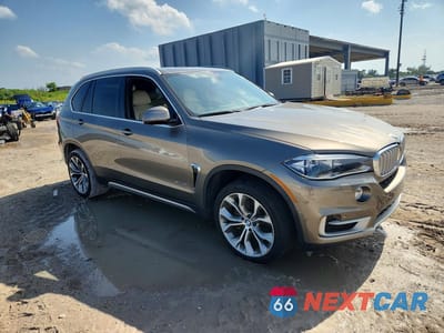 Czwarte zdjęcie samochodu z boku: 2017 BMW X5 XDR40E VIN:5UXKT0C30H0S81684 - miniatura