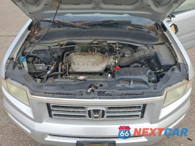 Zdjęcie 11 z 13 samochodu: 2006 HONDA RIDGELINE RTS VIN:2HJYK16416H571994 - miniatura