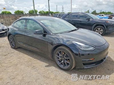 Czwarte zdjęcie samochodu z boku: 2023 TESLA MODEL 3 VIN:5YJ3E1EA2PF456731 - miniatura