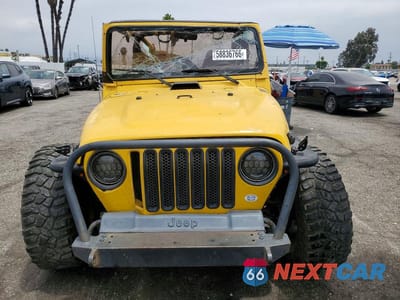 Piąte zdjęcie samochodu w środku: 2000 JEEP WRANGLER / TJ SPORT VIN:1J4FA49S0YP738560 - miniatura