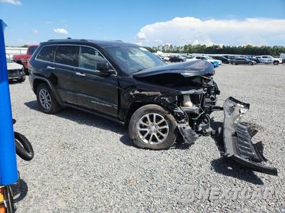 Czwarte zdjęcie samochodu z boku: 2014 JEEP GRAND CHEROKEE LIMITED VIN:1C4RJFBG1EC534910 - miniatura