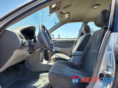 Zdjęcie 7 z 12 samochodu: 2001 TOYOTA COROLLA LE VIN:1NXBR12E01Z461539 - miniatura