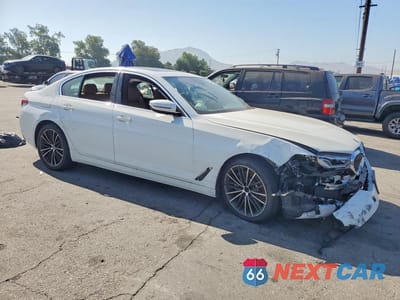 Czwarte zdjęcie samochodu z boku: 2021 BMW 530E VIN:WBA13AG0XMCF03661 - miniatura