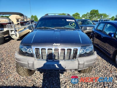 Piąte zdjęcie samochodu w środku: 1999 JEEP GRAND CHEROKEE SPORT VIN:1J4GW58S6XC587386 - miniatura