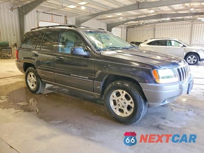 Czwarte zdjęcie samochodu z boku: 1999 JEEP GRAND CHEROKEE LAREDO VIN:1J4GW58S7XC553733 - miniatura
