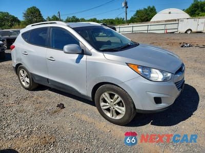 Czwarte zdjęcie samochodu z boku: 2011 HYUNDAI TUCSON GLS VIN:KM8JUCAC4BU300151 - miniatura