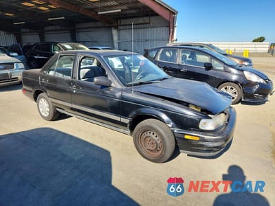 Czwarte zdjęcie samochodu z boku: 1993 NISSAN SENTRA E VIN:JN1EB31F9PU502614 - miniatura