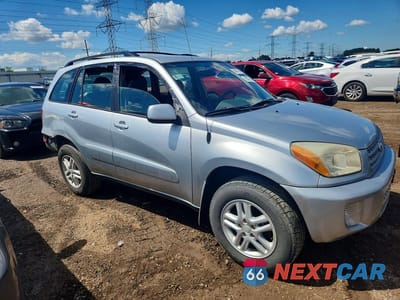 Czwarte zdjęcie samochodu z boku: 2001 TOYOTA RAV4 BASE VIN:JTEHH20V710102394 - miniatura