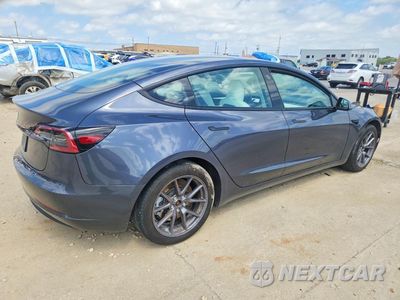 Trzecie zdjęcie samochodu z tyłu: 2023 TESLA MODEL 3 VIN:5YJ3E1EA3PF642519 - miniatura
