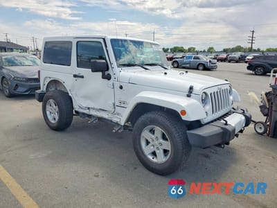 Czwarte zdjęcie samochodu z boku: 2016 JEEP WRANGLER SAHARA VIN:1C4AJWBG2GL143121 - miniatura