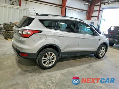Trzecie zdjęcie samochodu z tyłu: 2018 FORD ESCAPE SEL VIN:1FMCU9HD3JUA19449 - miniatura