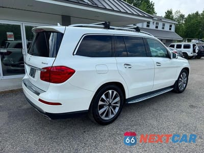 Czwarte zdjęcie samochodu z boku: 2013 MERCEDES-BENZ GL 450 4MATIC VIN:4JGDF7CE0DA157944 - miniatura