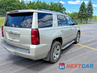 Czwarte zdjęcie samochodu z boku: 2015 CHEVROLET TAHOE K1500 LTZ VIN:1GNSKCKC8FR211258 - miniatura