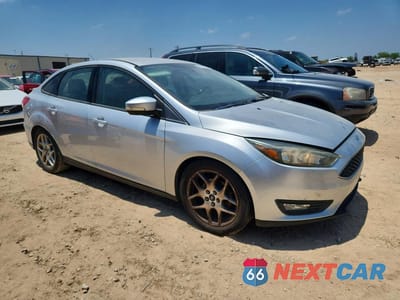 Czwarte zdjęcie samochodu z boku: 2015 FORD FOCUS SE VIN:1FADP3F21FL240582 - miniatura