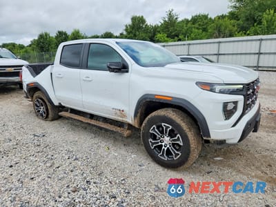 Czwarte zdjęcie samochodu z boku: 2023 GMC CANYON AT4 VIN:1GTP6DEK5P1255892 - miniatura
