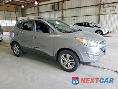 Czwarte zdjęcie samochodu z boku: 2013 HYUNDAI TUCSON GLS VIN:KM8JU3AC0DU763603 - miniatura