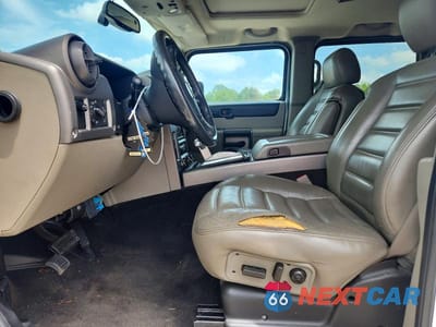 Zdjęcie 7 z 13 samochodu: 2004 HUMMER H2 VIN:5GRGN23U74H122421 - miniatura