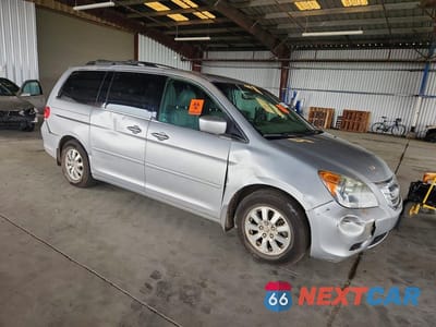 Czwarte zdjęcie samochodu z boku: 2010 HONDA ODYSSEY EXL VIN:5FNRL3H75AB023617 - miniatura