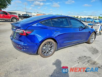 Trzecie zdjęcie samochodu z tyłu: 2022 TESLA MODEL 3 VIN:5YJ3E1EB8NF198785 - miniatura