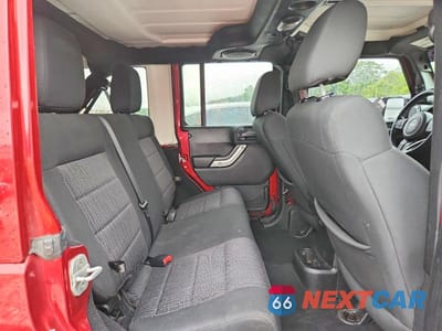 Zdjęcie 11 z 13 samochodu: 2012 JEEP WRANGLER UNLIMITED SAHARA VIN:1C4HJWEG2CL111886 - miniatura