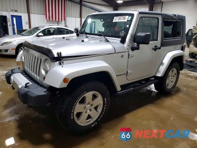 2010 JEEP WRANGLER SAHARA 1J4AA5D15AL214901 - główne zdjęcie licytacji z USA - miniatura