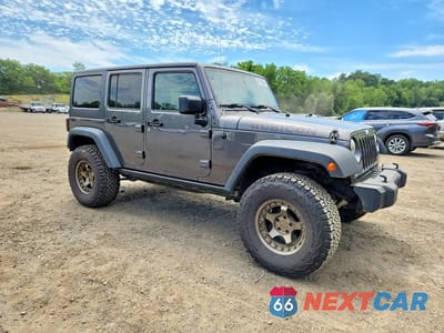Czwarte zdjęcie samochodu z boku: 2014 JEEP WRANGLER UNLIMITED RUBICON VIN:1C4BJWFG1EL214403 - miniatura