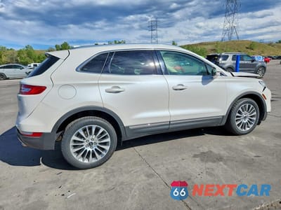 Trzecie zdjęcie samochodu z tyłu: 2015 LINCOLN MKC VIN:5LMCJ2A92FUJ30780 - miniatura