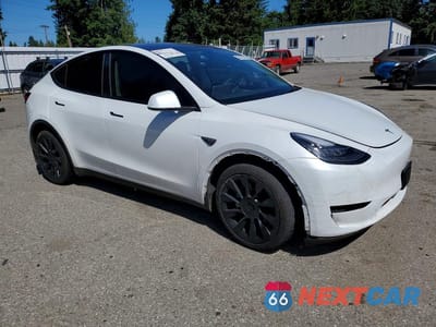 Czwarte zdjęcie samochodu z boku: 2023 TESLA MODEL Y VIN:7SAYGDEE3PA110420 - miniatura