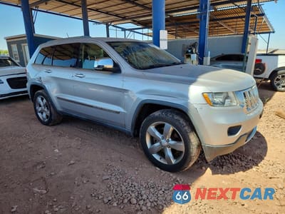 Czwarte zdjęcie samochodu z boku: 2011 JEEP GRAND CHEROKEE OVERLAND VIN:1J4RR6GT4BC647805 - miniatura