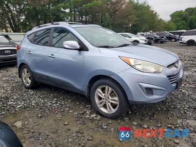 Czwarte zdjęcie samochodu z boku: 2012 HYUNDAI TUCSON GLS VIN:KM8JUCAC9CU417063 - miniatura