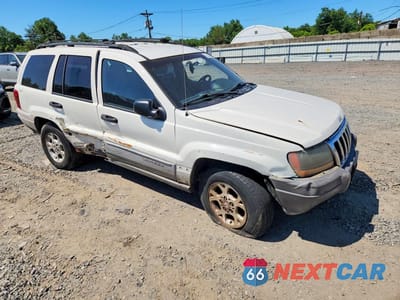 Czwarte zdjęcie samochodu z boku: 2000 JEEP GRAND CHEROKEE LAREDO VIN:1J4GW48S4YC341870 - miniatura