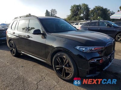 Czwarte zdjęcie samochodu z boku: 2021 BMW X7 XDRIVE40I VIN:5UXCW2C06M9F10553 - miniatura