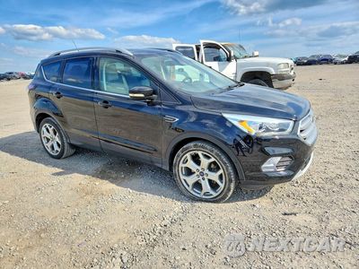 Czwarte zdjęcie samochodu z boku: 2017 FORD ESCAPE TITANIUM VIN:1FMCU0JD0HUA80306 - miniatura