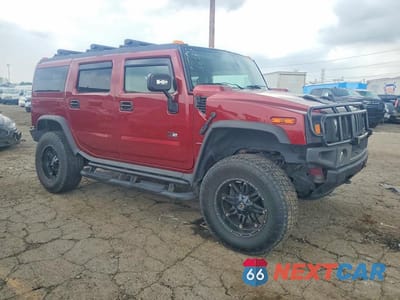 Czwarte zdjęcie samochodu z boku: 2004 HUMMER H2 VIN:5GRGN23UX4H111221 - miniatura