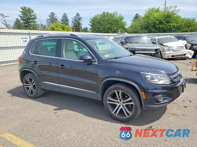 Czwarte zdjęcie samochodu z boku: 2017 VOLKSWAGEN TIGUAN SEL VIN:WVGWV7AX5HK021177 - miniatura
