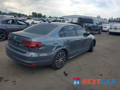 Trzecie zdjęcie samochodu z tyłu: 2016 VOLKSWAGEN JETTA SPORT VIN:3VWD17AJ3GM252148 - miniatura