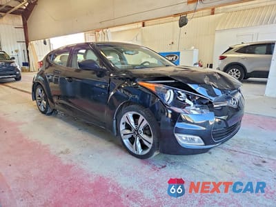 Czwarte zdjęcie samochodu z boku: 2014 HYUNDAI VELOSTER BASE VIN:KMHTC6AD0EU197143 - miniatura