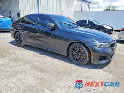 Czwarte zdjęcie samochodu z boku: 2022 BMW M340I VIN:3MW5U7J04N8C31222 - miniatura
