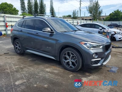 Czwarte zdjęcie samochodu z boku: 2017 BMW X1 SDRIVE28I VIN:WBXHU7C33H5H36022 - miniatura