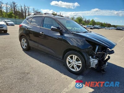 Czwarte zdjęcie samochodu z boku: 2012 HYUNDAI TUCSON GLS VIN:KM8JUCAC6CU491301 - miniatura