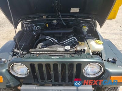 Zdjęcie 11 z 12 samochodu: 2004 JEEP WRANGLER / TJ SAHARA VIN:1J4FA59S64P768436 - miniatura